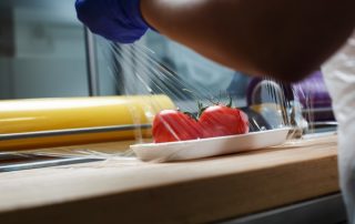 Grocery,Retailers.,Packing,Of,Food,Products.,Unknown,Worker,In,Blue